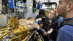 Раненый Олег и врач Инна в машине скорой помощи