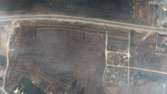 A satellite image by Maxar purportedly showing four sections of linear rows of graves near Mariupol