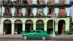 Brightly-painted buildings on Paseo de Marti opposite the National Capitol Building in Havana