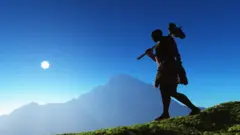 Photo concept: An early man walking on a primitive landscape