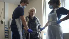 Hospital staff carry out physiotherapy