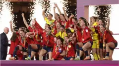 Ivana Andres of Spain and teammates celebrate with the FIFA Women's World Cup Trophy following victory in the FIFA Women's World Cup Australia & New Zealand 2023 Final match between Spain and England at Stadium Australia on August 20, 2023 in Sydney, Australia.