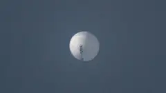 A balloon flies in the sky over Billings, Montana, U.S. February 1, 2023 in this picture obtained from social media.