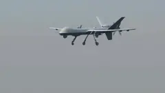 A US drone aircraft lands at Afghanistan's Jalalabad Airport where a US C-130 military transport plane crashed in Jalalabad on October 2, 2015