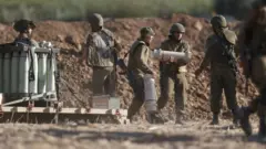 Israel has amassed artillery at the border with Gaza raising fears of a ground offensive