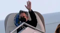 Secretary of State of U.S. Antony Blinken waves as he arrives at Boryspil International Airport, in Kyiv, Ukraine, January 19, 2021