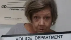 The mugshot of a woman charged with a bank robbery.