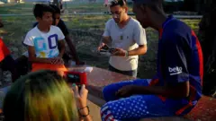 youtuber filmming a magician