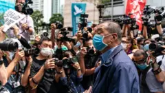 Hong Kong media tycoon and founder of Apple Daily newspaper Jimmy Lai arrives at the West Kowloon Magistrates' Court on May 18, 2020 in Hong Kong,