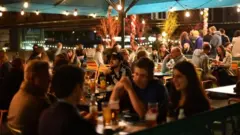 People drinking in a bar