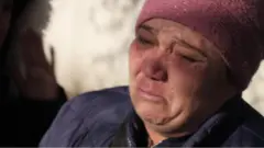 Bereaved woman in Kazakhstan