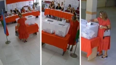 Xırdalanda üç məntəqədə səs verən və geyim dəyişdirən qırmızı geyimli qadın.