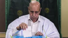 Incumbent Mauritanian President Mohamed Ould Ghazouani casts his ballot at a polling station in Nouakchott on June 29, 2024.
