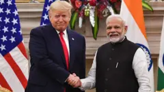 India's Prime Minister Narendra Modi (R) shakes hands with US President Donald Trump before a meeting at Hyderabad House in New Delhi on February 25, 2020. (Photo by Mandel NGAN / AFP) (Photo by MANDEL NGAN/AFP via Getty Images) INDIA-US-DIPLOMACY-TRUMP  Save  Comp  Embed PREMIUM ACCESS