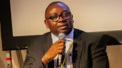 Bayo Adelabu wit mic for im mouth