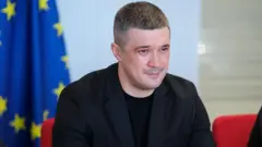 Mykhailo Fedorov, con traje oscuro y una medio sonrisa