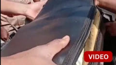 பைக் சீட்டில் பதுக்கியிருந்த ரூ.56 லட்சம் பணம் பறிமுதல்