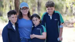Joanne and Austin with Beau, 12, and Grace, eight
