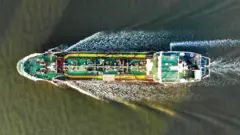 Overhead shot of a large ship in the Strait of Hormuz