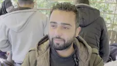 Alaa Abu Hihal, a bearded man with tears in his eyes, pictured at Nasser Hospital in Khan Yunis
