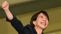 Liberal Democratic Party President and Prime Minister Sanae Takaichi raises her fist in a celebratory fashion during a speech in southern Tokyo on 31 January 2026.