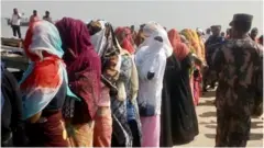 অবৈধভাবে মালয়েশিয়া যাওয়ার চেষ্টা সময় মঙ্গলবার ডুবে যাওয়া ট্রলার থেকে উদ্ধারপ্রাপ্তদের একাংশ