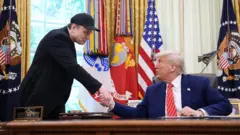 Donald Trumpm ati Elon Musk
