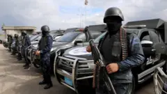 Central security support force carry weapons during the security deployment in the Tajura neighborhood, east of Tripoli, Libya January 14, 2020.