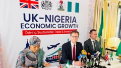 British High Commissioner to Nigeria, Richard Montgomery (centre), flanked by Zara Mustapha Audu, the Director General, Presidential Enabling Business Environment Council, (Pebec), and Mark Smithson, the country director for the UK's department for business and trade.