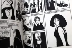 Un cómic abierto en el que se ven ilustraciones de una mujer en Irán