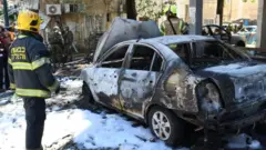 Police and rescue teams at the scene of a direct rocket hit in Ramat Gan, Israel, May 15, 2021