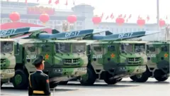 Image shows DF-17 medium-range ballistic missiles equipped with a DF-ZF hypersonic glide vehicle, involved in a military parade to mark the 70th anniversary of the Chinese People's Republic