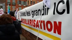 . The collective RESF (Reseau Education Sans Frontieres ie Education Without Borders Network) organized a gathering in font of the Prefecture of Haute-Garonne to ask the Prefet to stop all evictions of children and their families as French laws say that every child must be educated regardless of their situation (even if the child has not papers). Toulouse. France. March 4th 2020.