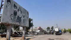 Irak'ın kuzeyindeki Ninova vilayetinin Bartalla bölgesinde saldırının meydana geldiği alanda hasar görmüş yapılar görülüyor. (29 Temmuz 2026)