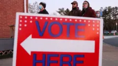 Voters wait in line at a polling location at the Old Stone School in Hillsboro, Virginia, USA, 03 November 2020.