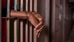 Foto of man wit handcuff for prison