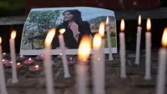 A photo of Mahsa Amini is pictured at a meeting organised by students and activists from Delhi University in New Delhi, India