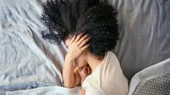 A woman with a migraine