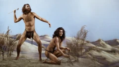 Prehistoric man next to woman kneeling 