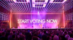 Сцена с надписью Start Voting Now.