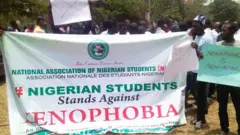 NANS students carri banner to protest Xenophobia kill kill for students abroad