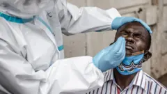 Kenyan man undergoing swab test