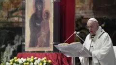 Pope Francis reads his "Urbi et Orbi" ("To the City and the World") message in St. Peter's Basilica