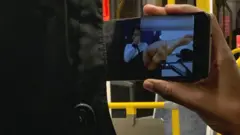 A man watching porn on public transport
