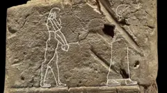 carving-of-ghost-on-tablet