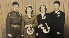 Tommy Budge, Thelma Budge, Violet Flett and Leslie Flett, old wedding day photo of two grooms and brides on their wedding day, one of the men is in uniform.