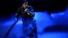 An actor, wearing a Russian military uniform with a pro-war Z-symbolymbol