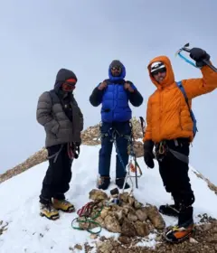 three mountain climbers