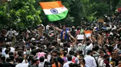 India cockroach protesters dey jubilate afta di minister of education resign