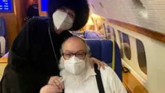 Jonathan Pollard and his wife Esther on board a private jet flying to Tel Aviv